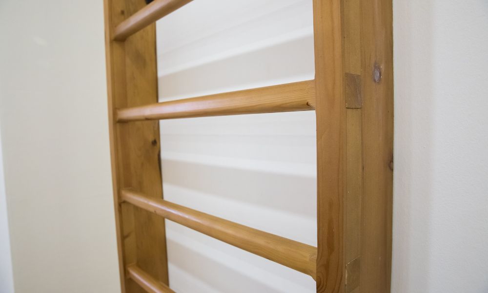 Benefits of Adding Wooden Stall Bars to Your Gym