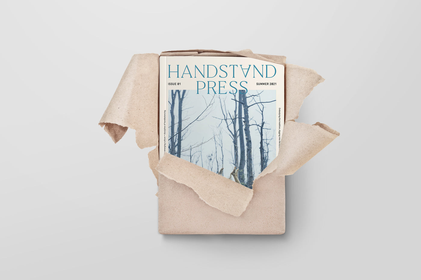 First issue of The Handstand Press magazine being opened.