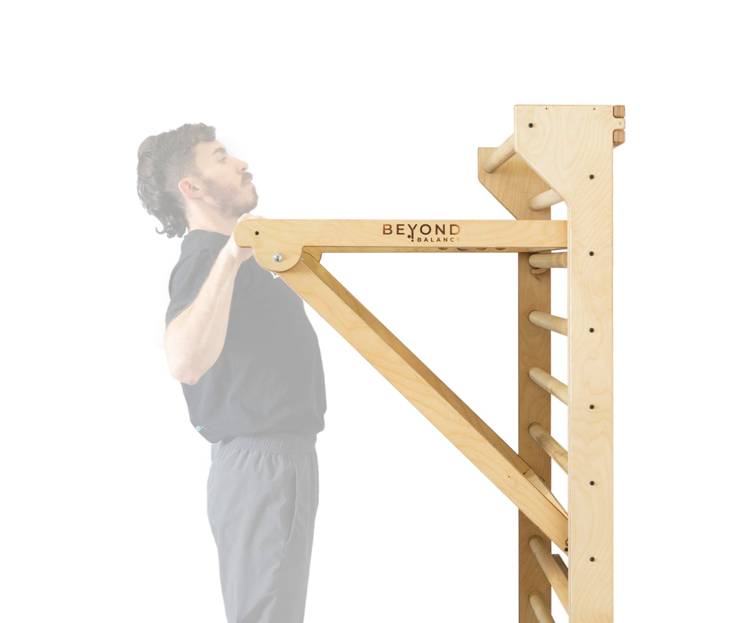 Adjustable pull-up dip attachment in a central position with athlete performing a pull up